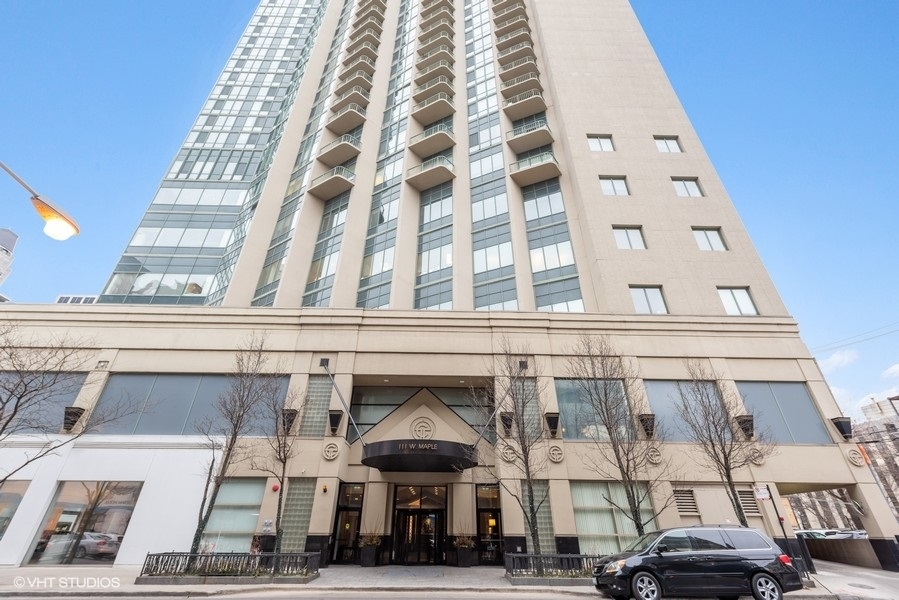 111 West Maple Street, Unit 2611 Chicago, IL 60610 - Photo 2 of 11 a view of building with car parked