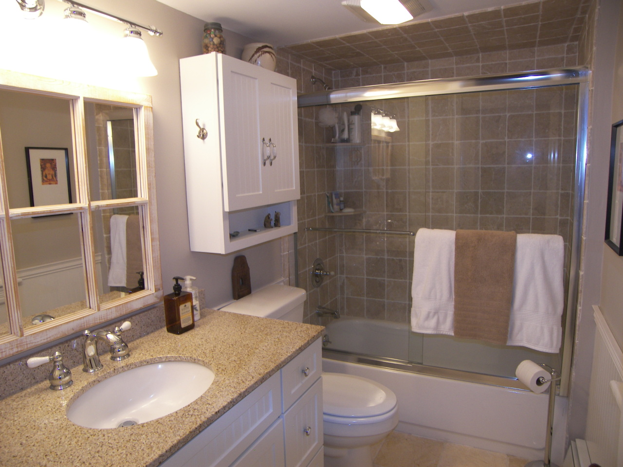 238 Maxim Road Howell, NJ 07731 - Photo 1 of 3 a bathroom with a granite countertop sink a toilet a mirror and shower