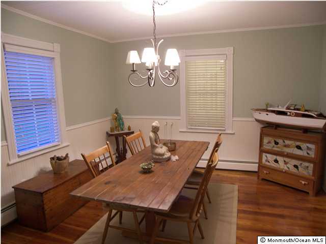 238 Maxim Road Howell, NJ 07731 - Photo 3 of 3 a view of a dining room with furniture a chandelier and wooden floor