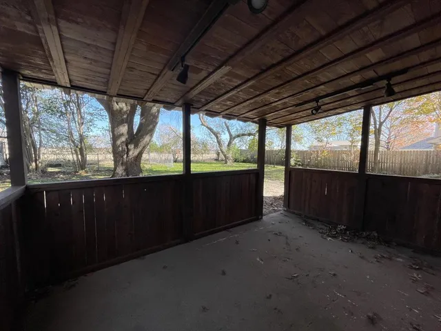 a view of porch with green space