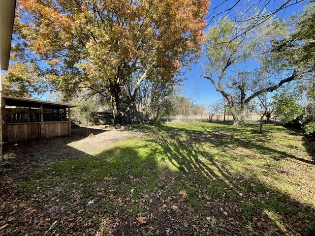 a view of backyard with green space