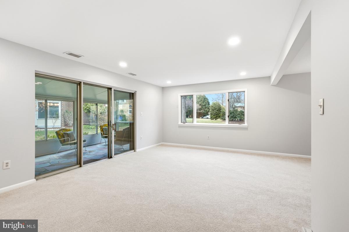 3436 Chiswick Court, Unit 45H Silver Spring, MD 20906 - Photo 16 of 30 an empty room with windows lake and mountain view