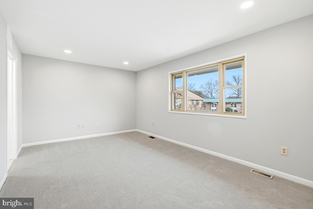 3436 Chiswick Court, Unit 45H Silver Spring, MD 20906 - Photo 26 of 30 an empty room with a painting on the wall