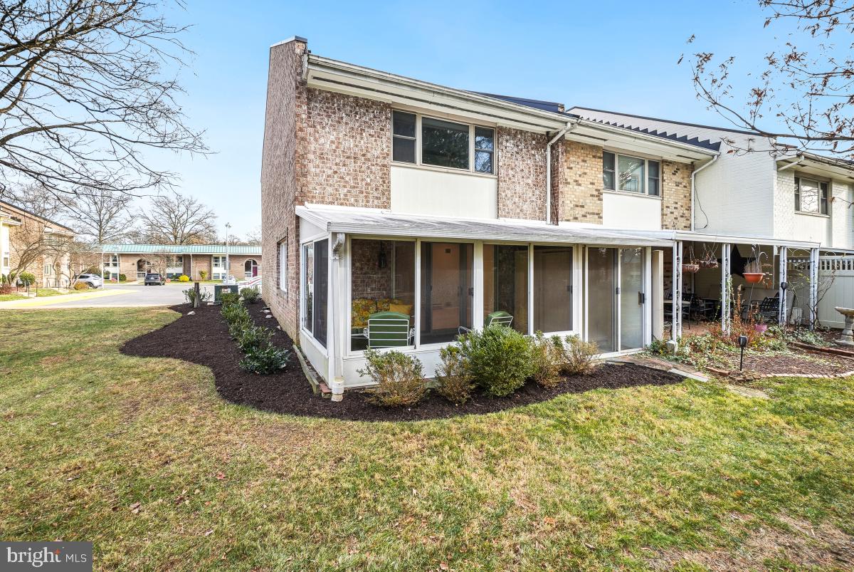 3436 Chiswick Court, Unit 45H Silver Spring, MD 20906 - Photo 29 of 30 a front view of a house with garden