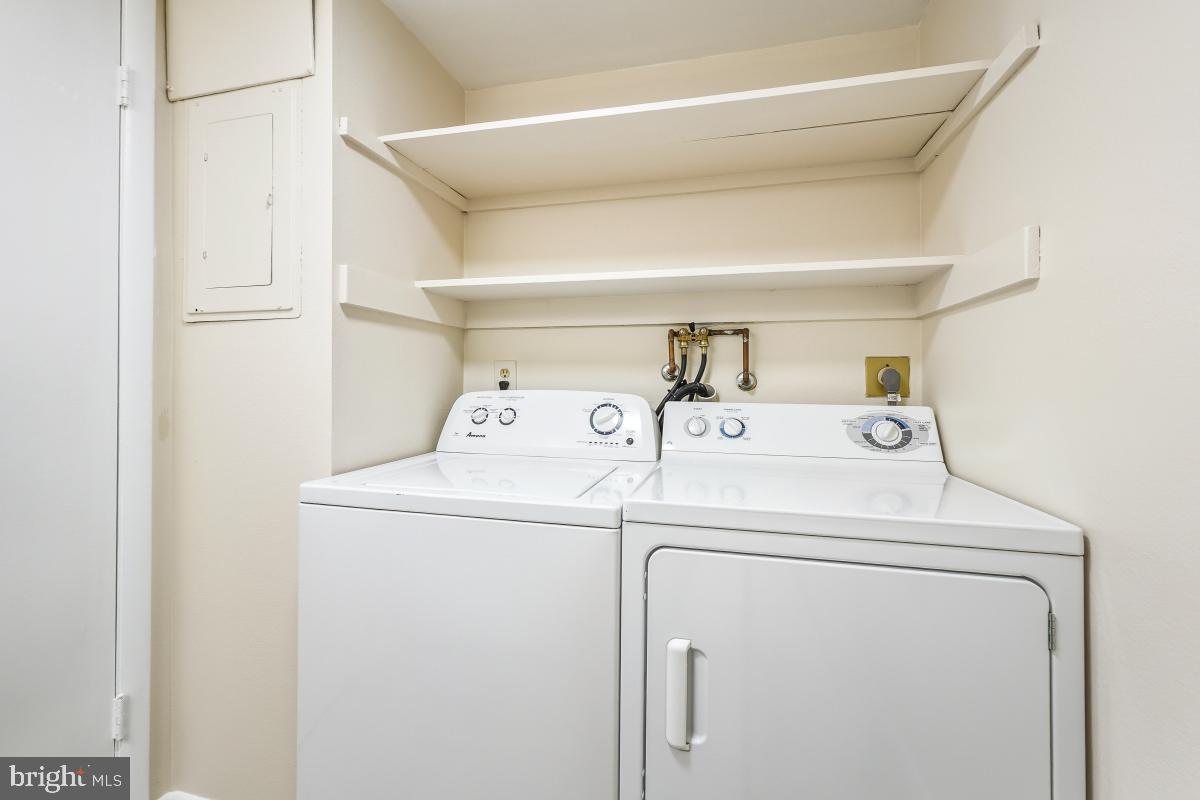 3436 Chiswick Court, Unit 45H Silver Spring, MD 20906 - Photo 7 of 30 a utility room with dryer and washer