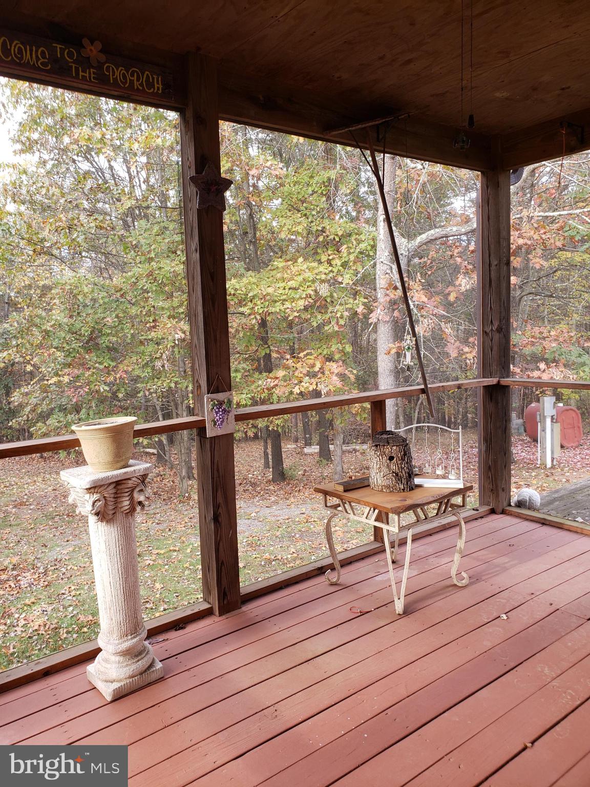 820 Packing House Road Berkeley Springs, WV 25411 - Photo 3 of 34 Side screened porch