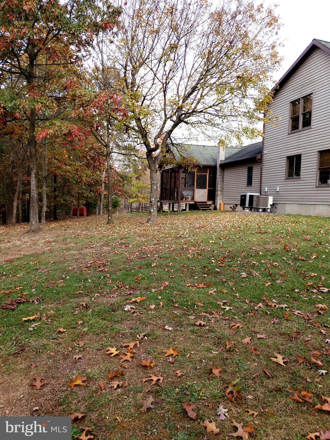 820 Packing House Road Berkeley Springs, WV 25411 - Photo 23 of 34 side of house with screened porch