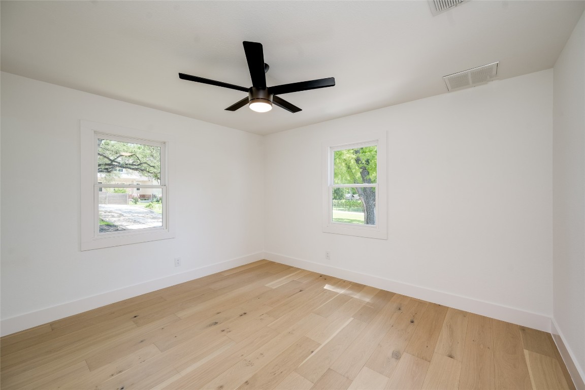 1928 Miles Avenue, Unit 1 Austin, TX 78745 - Photo 17 of 28 a view of a room with a window and a ceiling fan