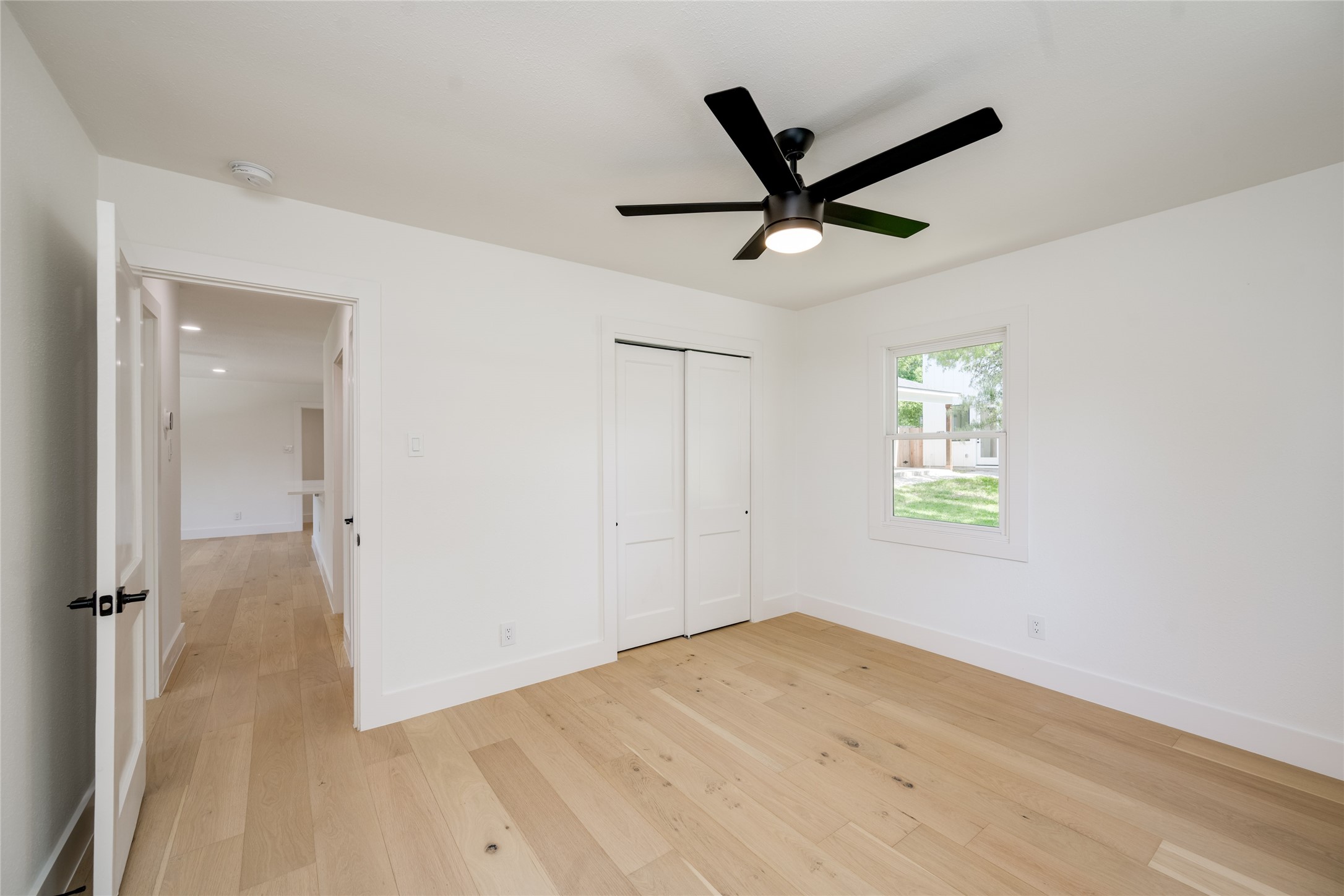 1928 Miles Avenue, Unit 1 Austin, TX 78745 - Photo 19 of 28 a view of a livingroom with a window and wooden floor