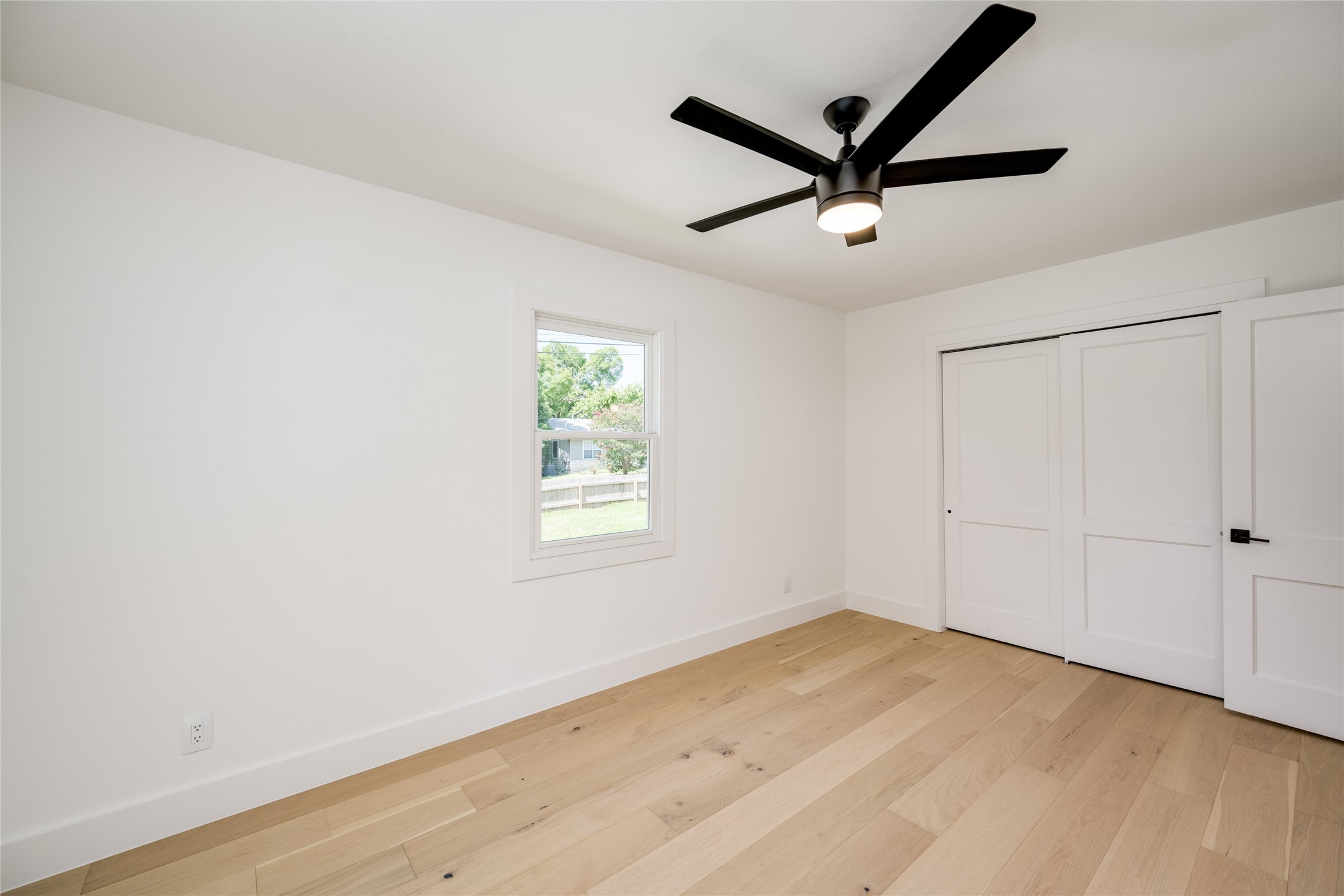 1928 Miles Avenue, Unit 1 Austin, TX 78745 - Photo 21 of 28 a view of a ceiling fan with a window