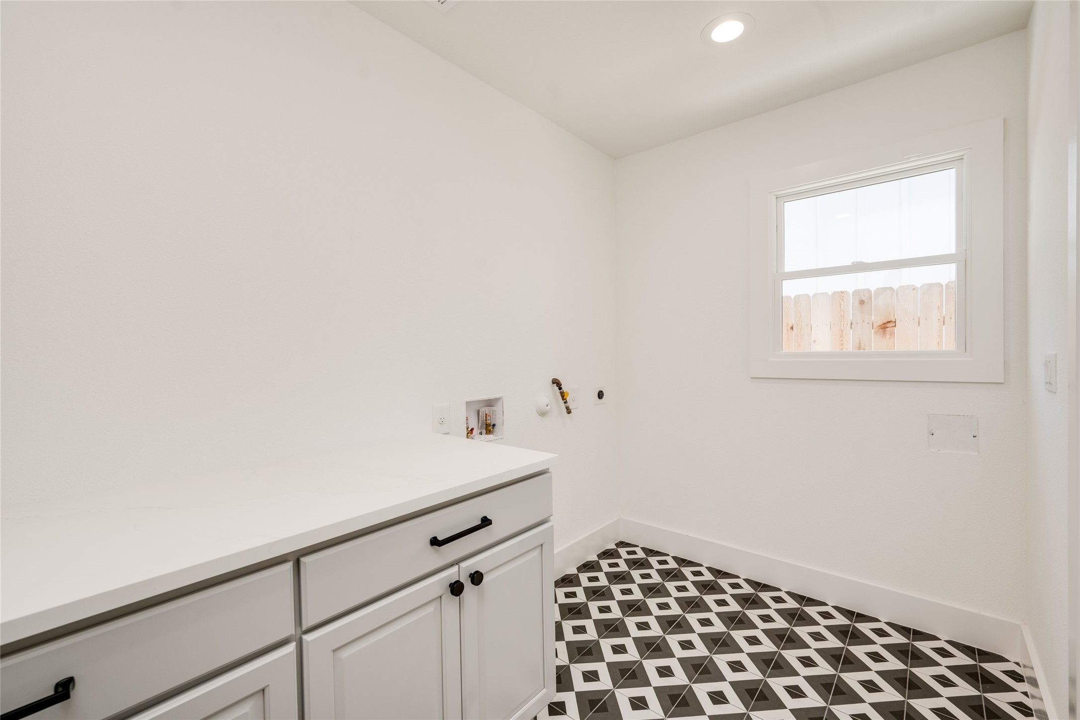 1928 Miles Avenue, Unit 1 Austin, TX 78745 - Photo 26 of 28 a room with a white cabinet and a window