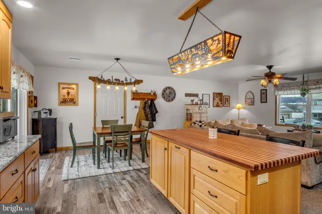 a kitchen with a table and chairs in it