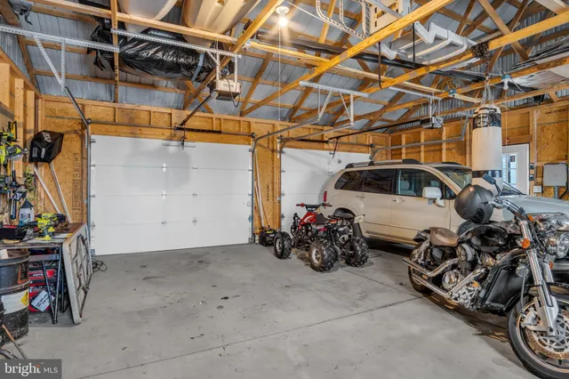a bathroom with a sink and view of snow