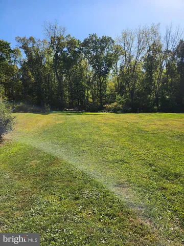 a view of a back yard of the house