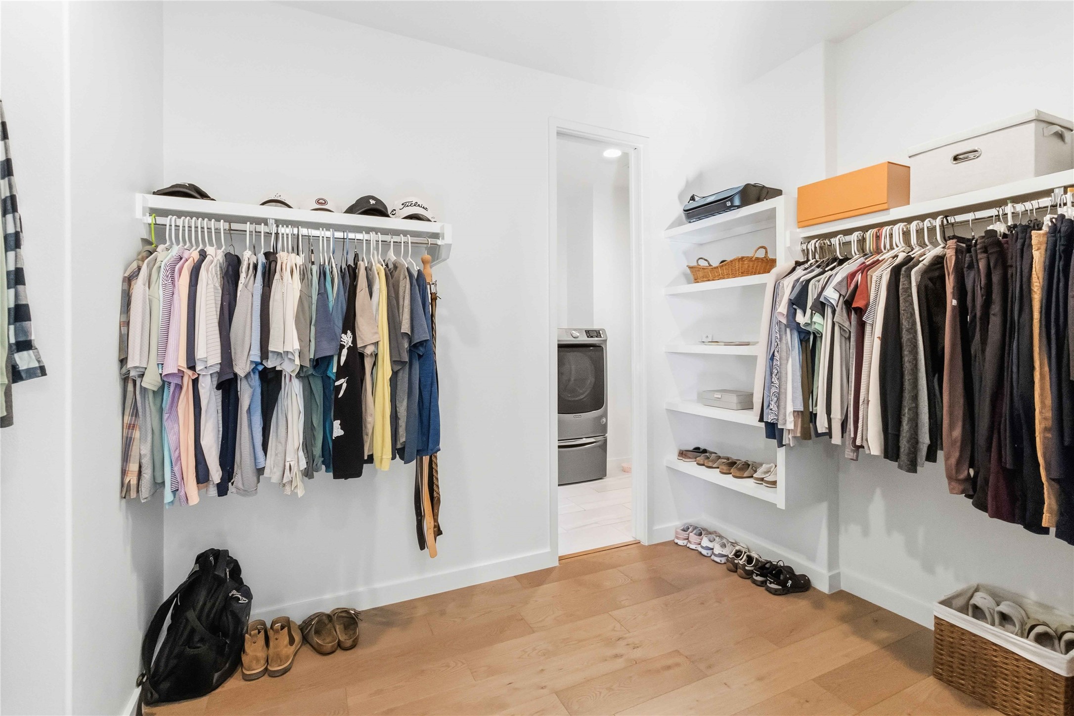 410 Kayak Way Austin, TX 78738 - Photo 21 of 39 a view of walk in closet with clothes and shoes