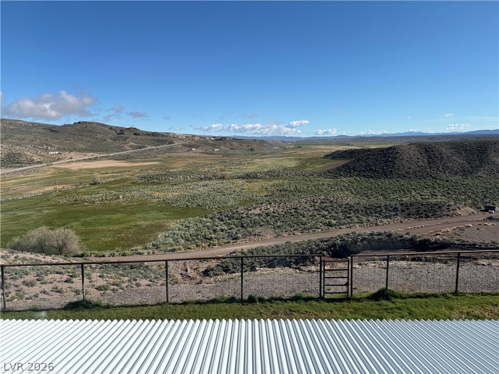 9393 North 93rd Highway Caliente, NV 89008 - Photo 31 of 41 Panoramic views sweep across the rugged landscape, offering a serene, expansive vista.