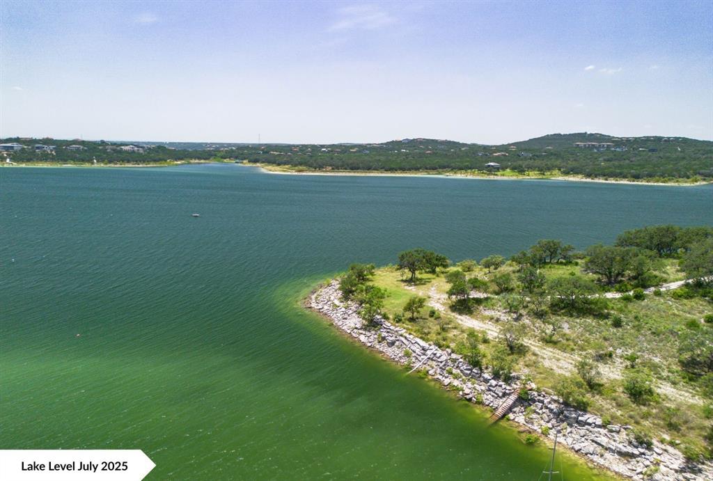 8005 Sharon Road Volente, TX 78641 - Photo 17 of 24 a view of a lake with a mountain in the background