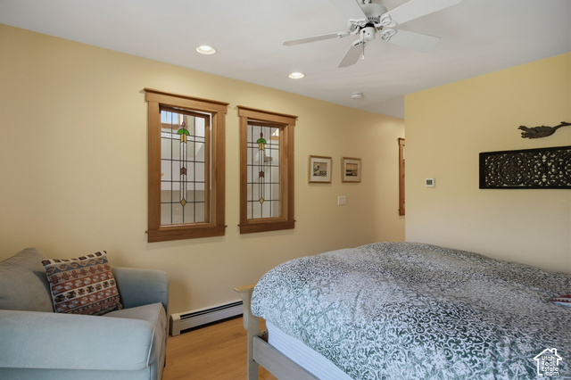725 Canyon Road Smithfield, UT 84335 - Photo 53 of 100 Two stained glass windows with wood trim, recessed lighting, ceiling fan, and light wood-finish flooring