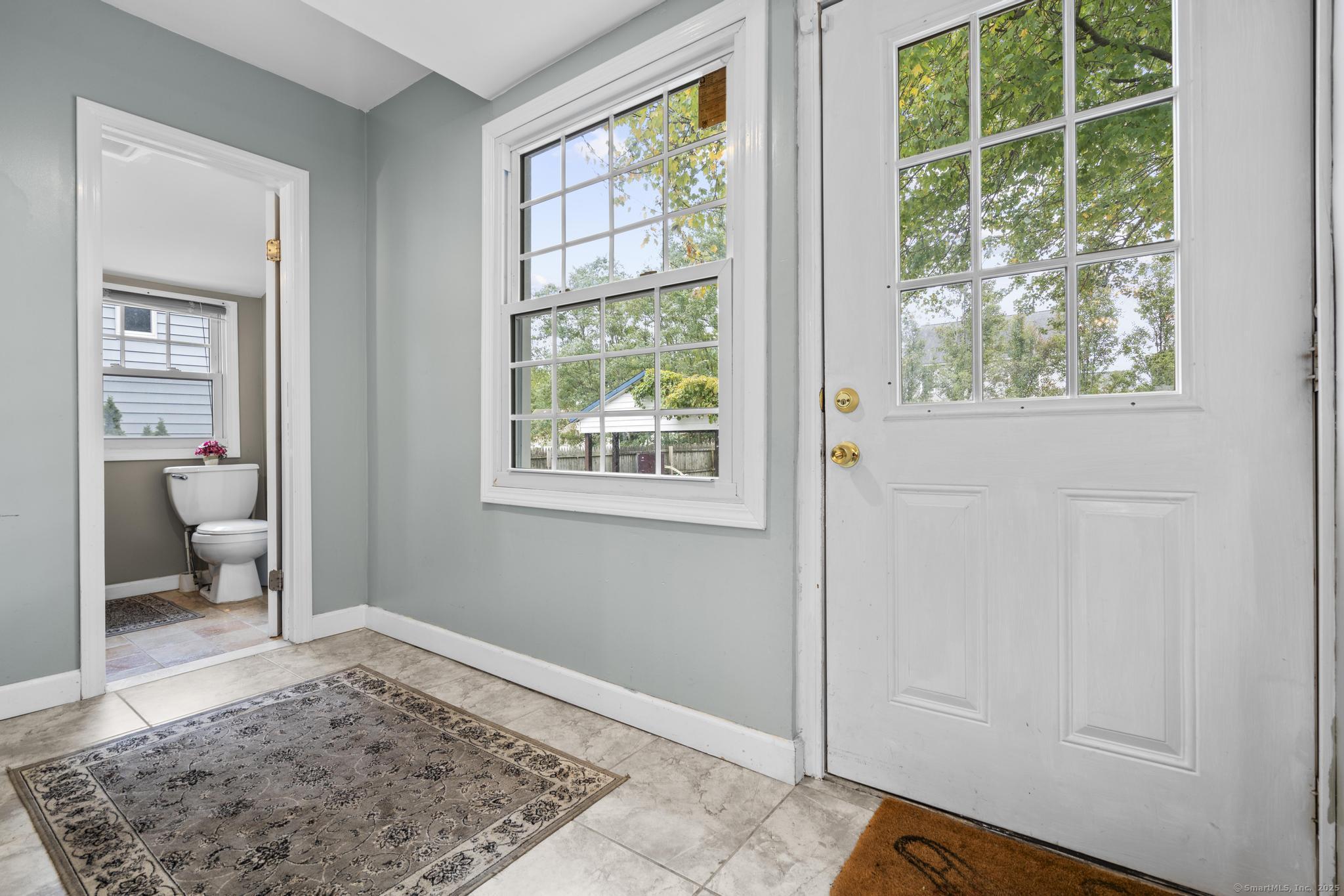 709 Tunxis Hill Road Fairfield, CT 06825 - Photo 11 of 30 a view of a bedroom with a window and wooden floor