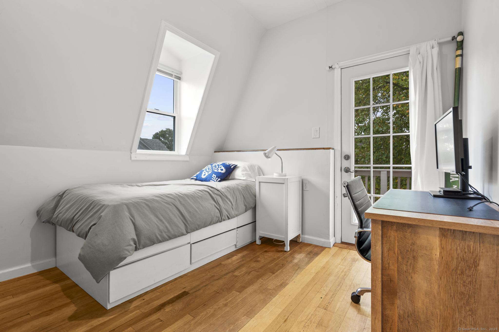 709 Tunxis Hill Road Fairfield, CT 06825 - Photo 14 of 30 a bedroom with a bed and a window