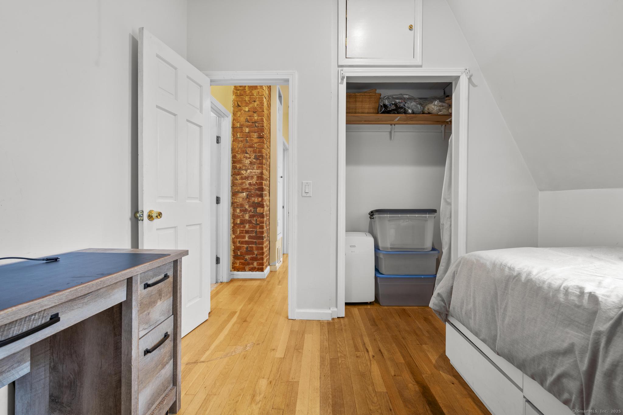 709 Tunxis Hill Road Fairfield, CT 06825 - Photo 15 of 30 a bedroom with a bed and a dresser