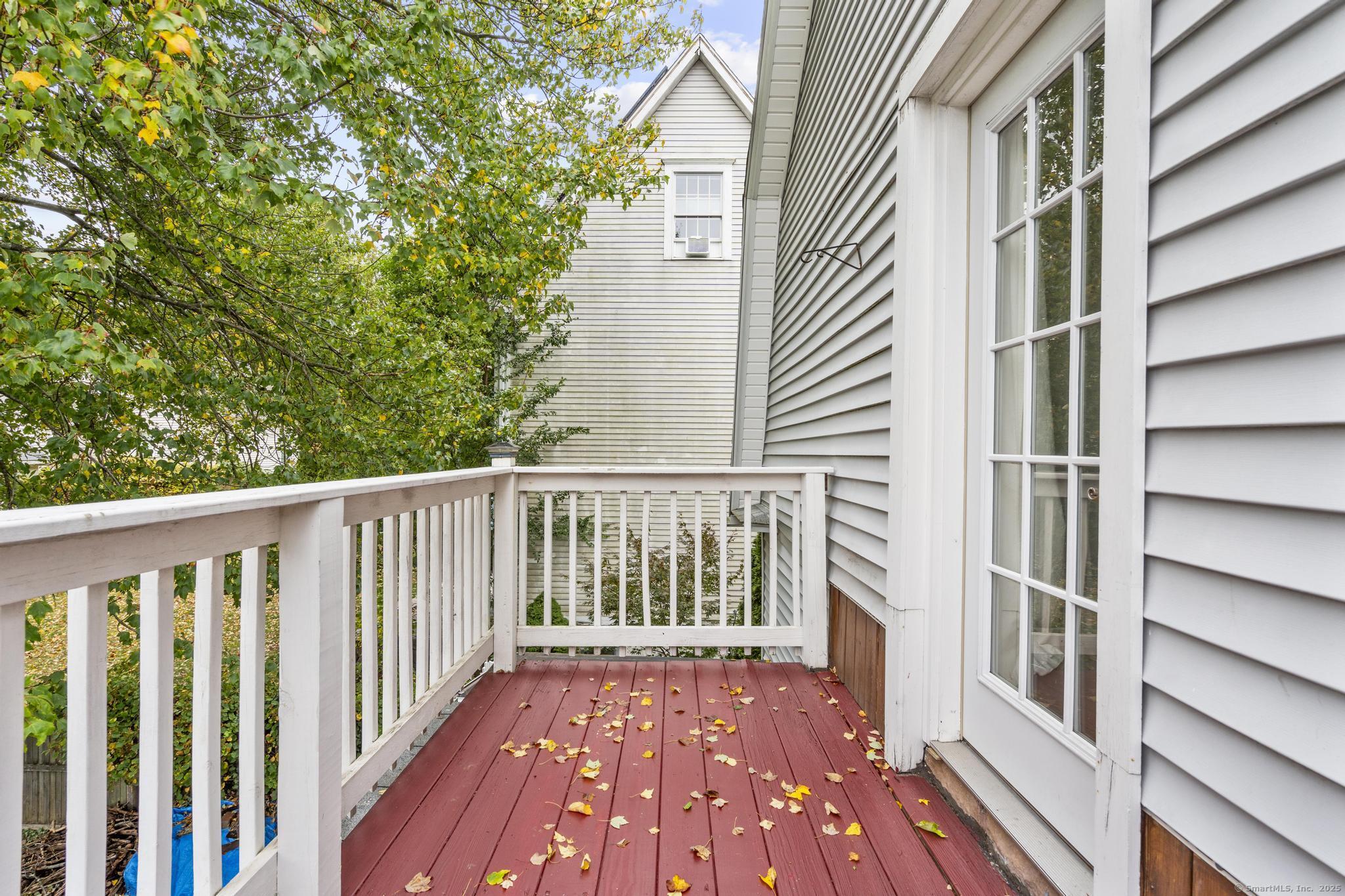 709 Tunxis Hill Road Fairfield, CT 06825 - Photo 16 of 30 a view of a balcony with wooden floor