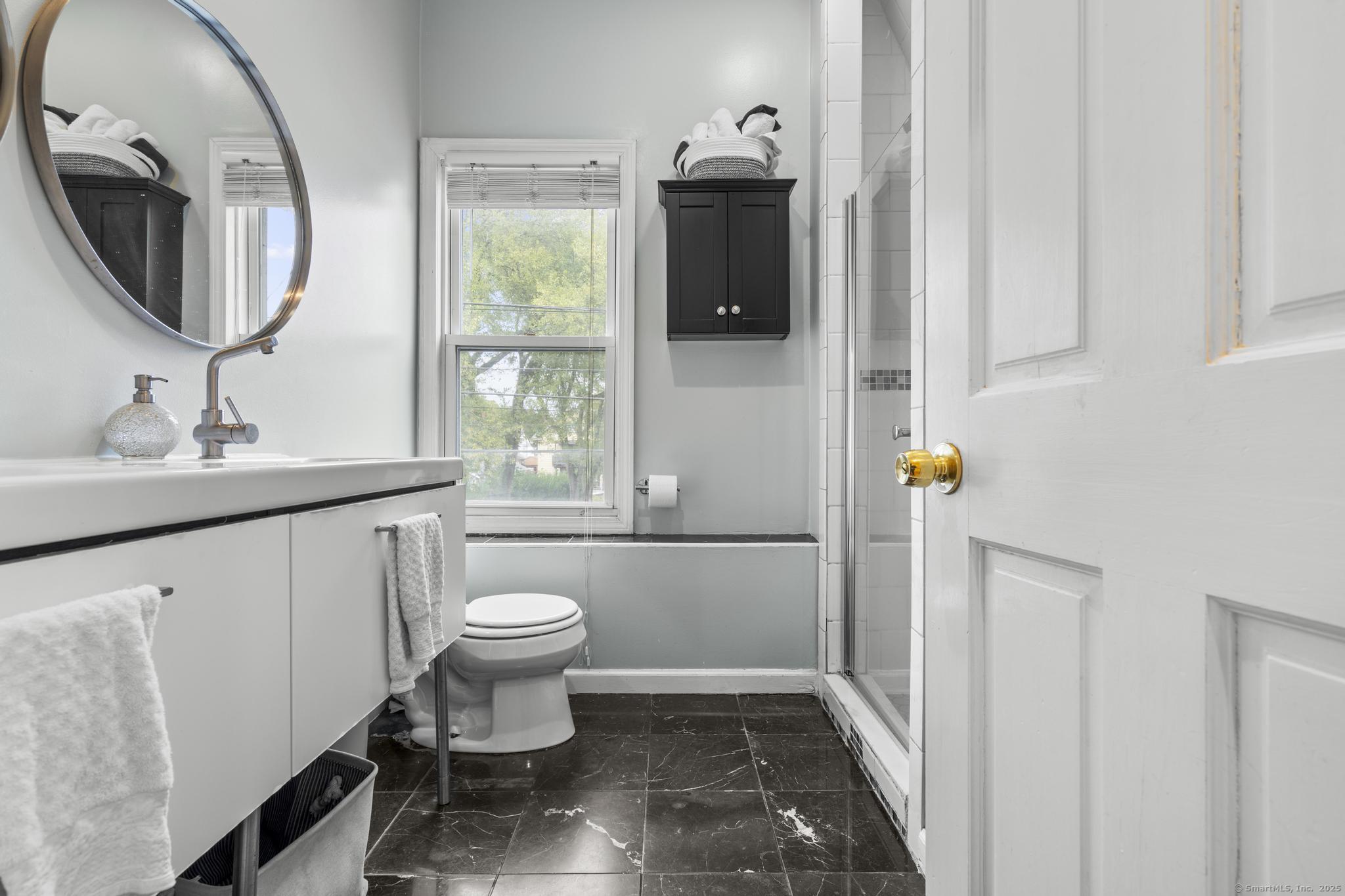 709 Tunxis Hill Road Fairfield, CT 06825 - Photo 21 of 30 a bathroom with a sink toilet and a mirror