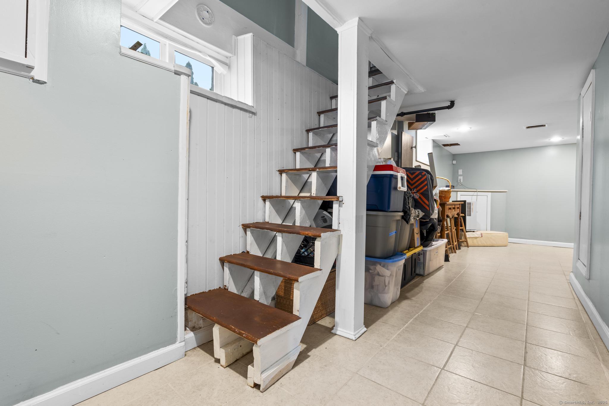 709 Tunxis Hill Road Fairfield, CT 06825 - Photo 23 of 30 a view of livingroom with furniture and workspace