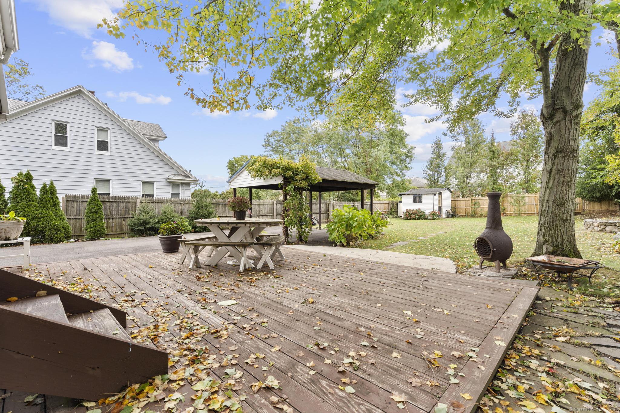 709 Tunxis Hill Road Fairfield, CT 06825 - Photo 26 of 30 a view of a backyard with sitting area