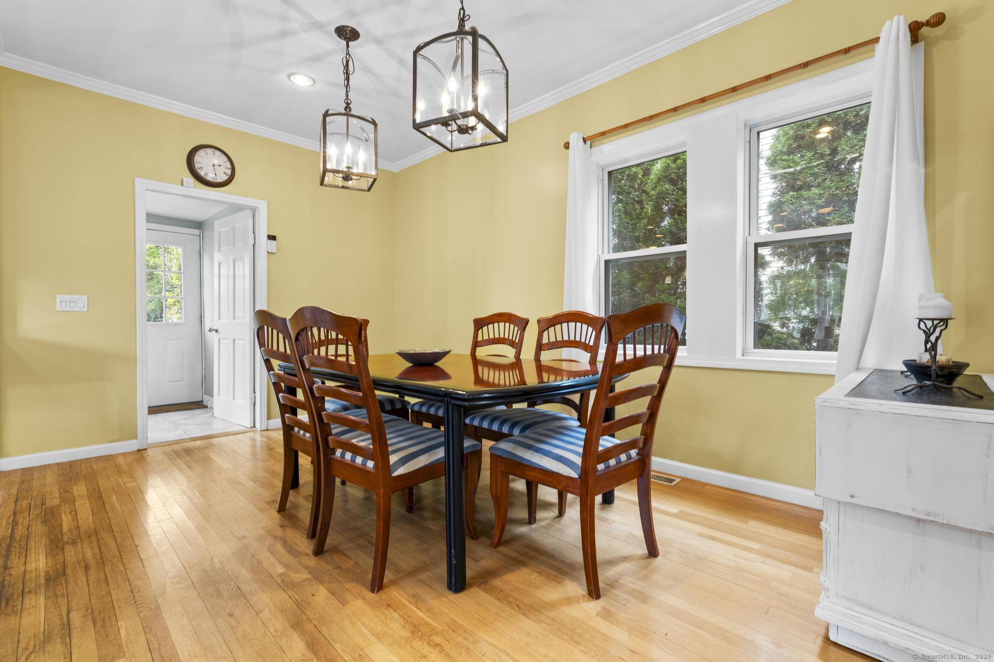 709 Tunxis Hill Road Fairfield, CT 06825 - Photo 6 of 30 a view of a dining room with furniture window and wooden floor