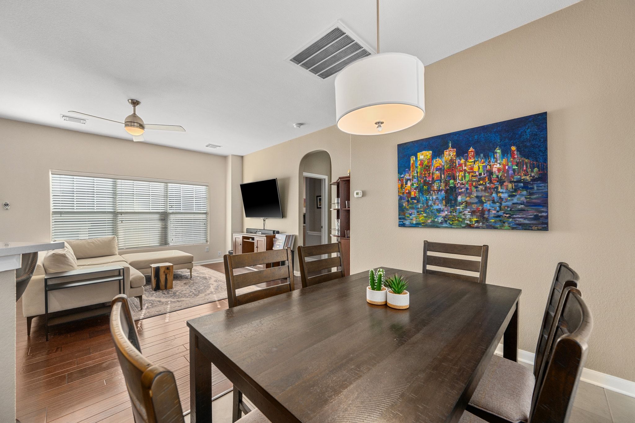 2905 Saville Loop Austin, TX 78741 - Photo 12 of 30 a view of a dining room with furniture large window and wooden floor
