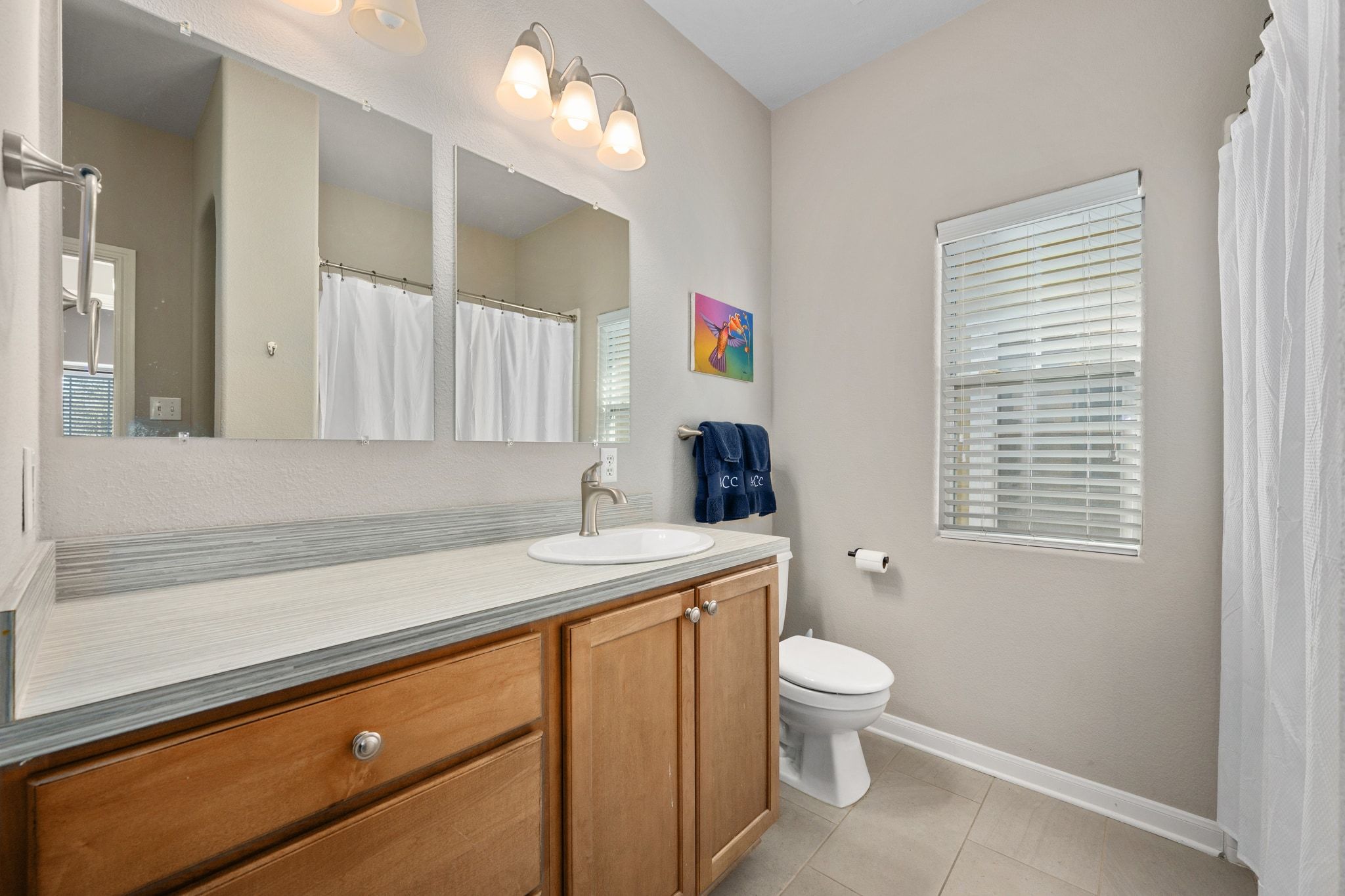 2905 Saville Loop Austin, TX 78741 - Photo 18 of 30 a bathroom with a sink a toilet and shower