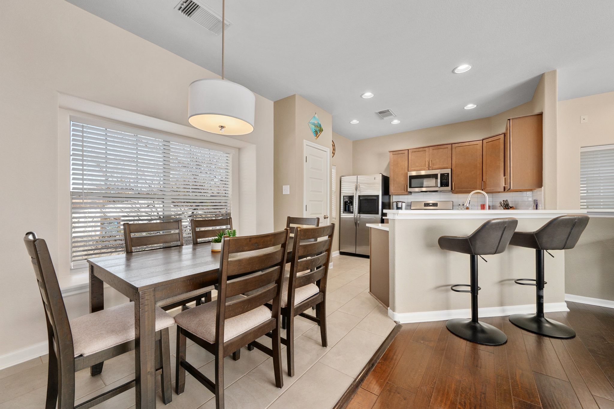 2905 Saville Loop Austin, TX 78741 - Photo 10 of 30 a dining room with furniture and wooden floor