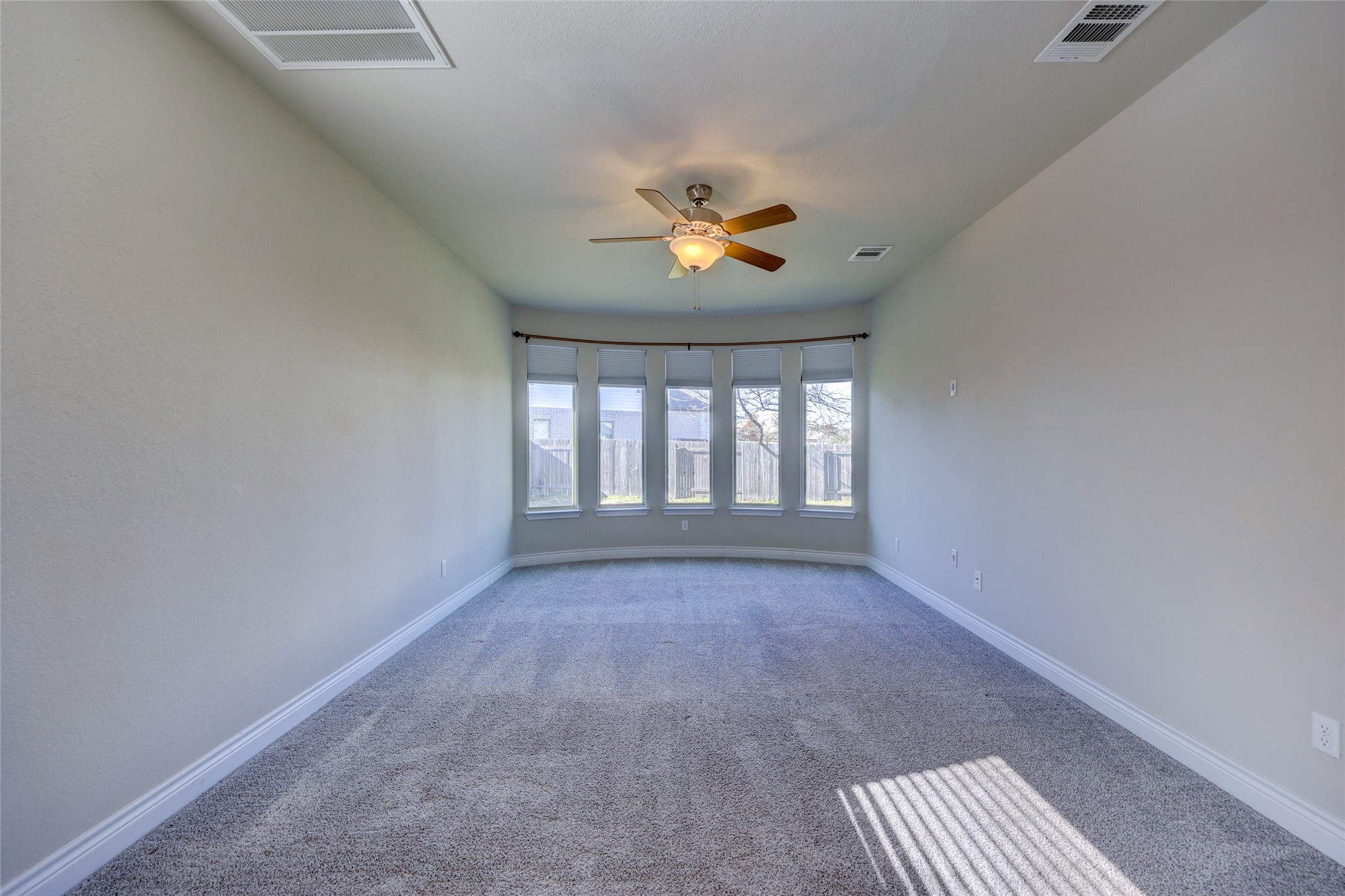 431 Millard Street Georgetown, TX 78628 - Photo 18 of 36 Unfurnished Master Bedroom with a ceiling fan and carpet floors