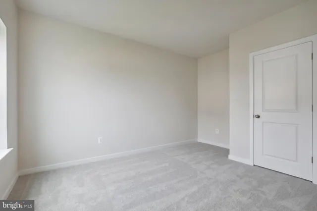 a view of an empty room and entryway