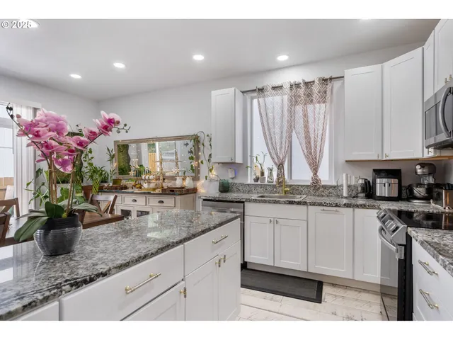 a kitchen with sink and cabinets