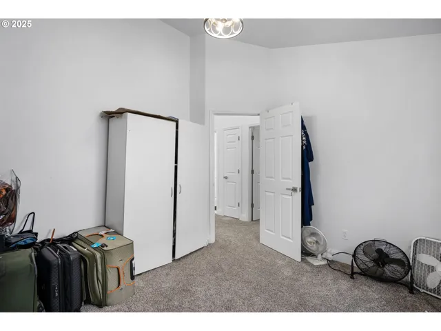 a living room with furniture and a air conditioner