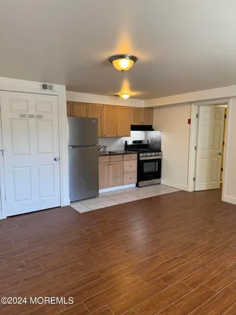 a view of a kitchen with a dishwasher and a refrigerator
