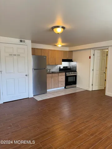 a view of a kitchen with a dishwasher and a refrigerator