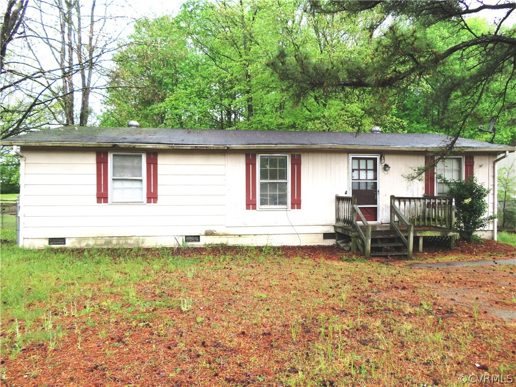 a backyard of a house with yard and outdoor seating