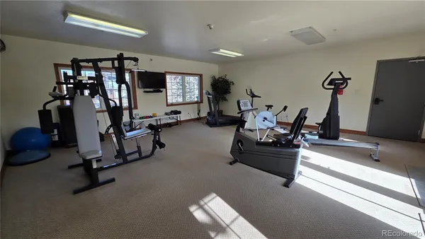 a room with a door open to a room