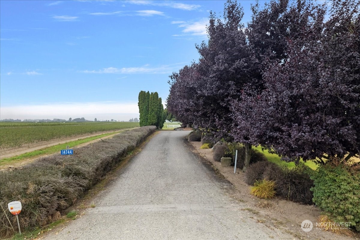 14744 Beaver Marsh Road Mount Vernon, WA 98273 - Photo 3 of 40 a view of a pathway with a wrought fence