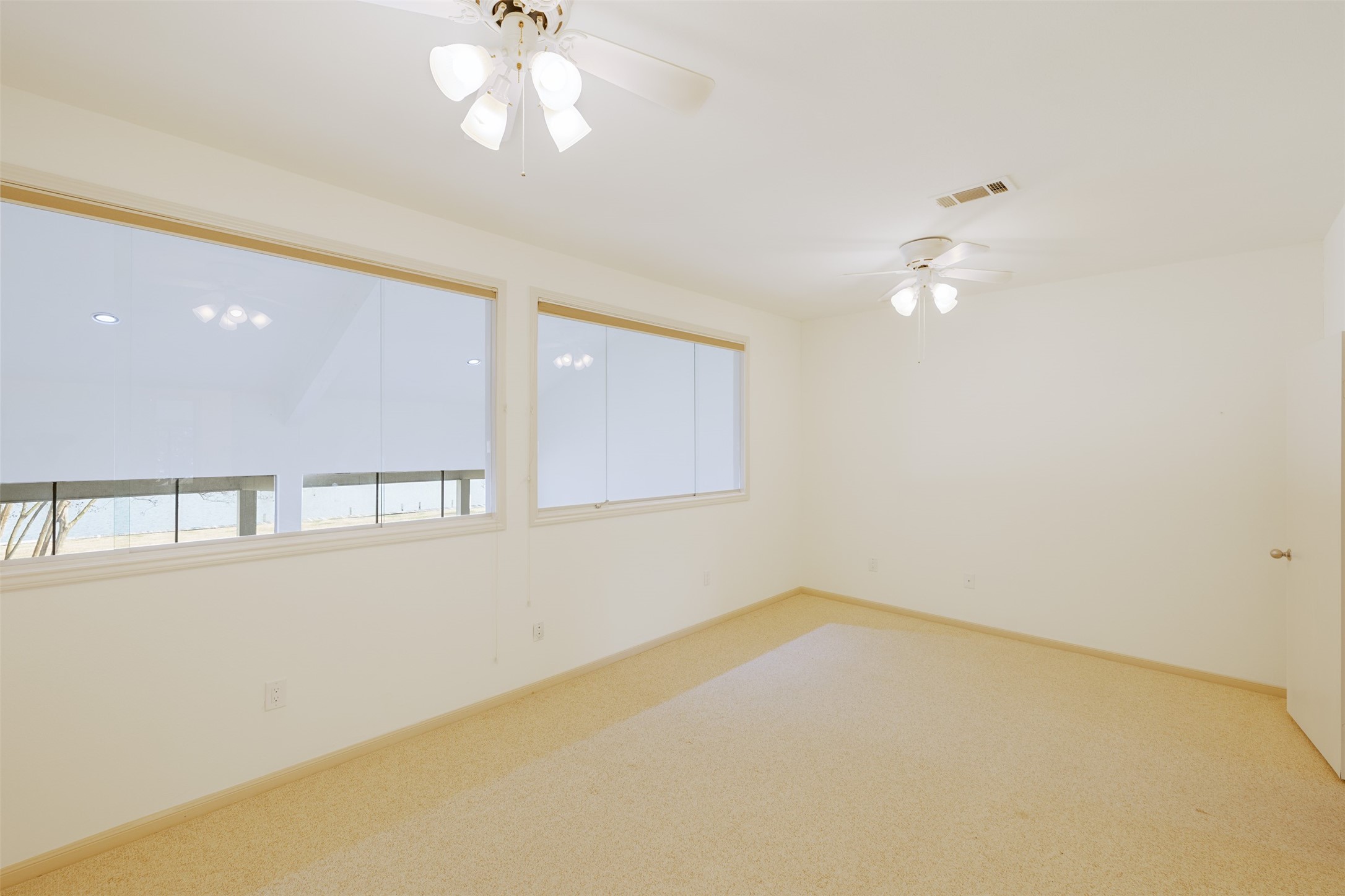 135 April Point Drive South Conroe, TX 77356 - Photo 30 of 45 Bedroom #2 gets tons of natural light and lake views!