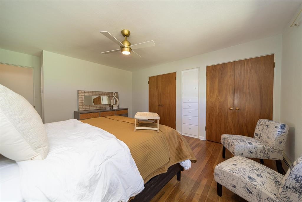 604-26 26 1/2 Road Grand Junction, CO 81506 - Photo 14 of 21 a bedroom with a bed and wooden floor