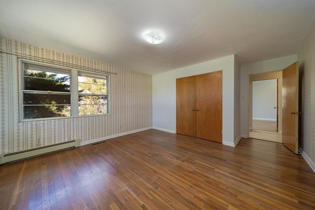 604-26 26 1/2 Road Grand Junction, CO 81506 - Photo 17 of 21 an empty room with wooden floor and windows
