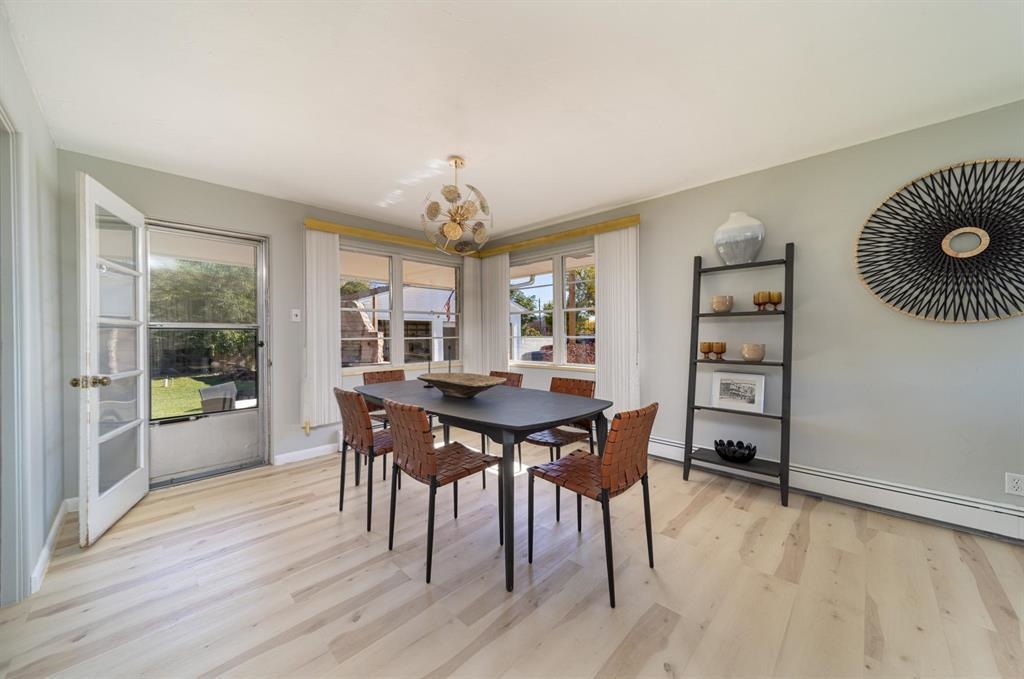 604-26 26 1/2 Road Grand Junction, CO 81506 - Photo 7 of 21 a view of a dining room with furniture and wooden floor