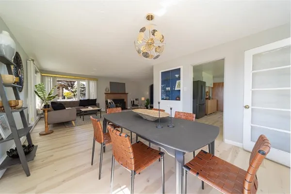 a view of a dining room with furniture and a window