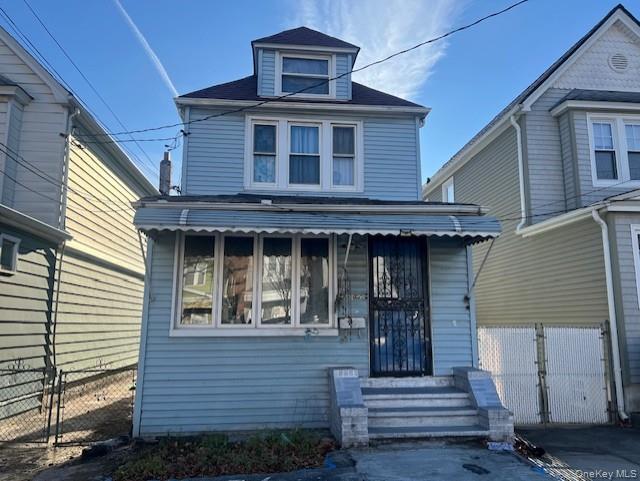 a front view of a house with stairs