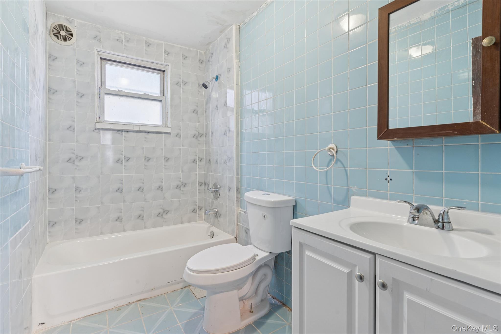 62-82 Booth Street Queens, NY 11374 - Photo 7 of 9 a bathroom with a sink toilet and shower