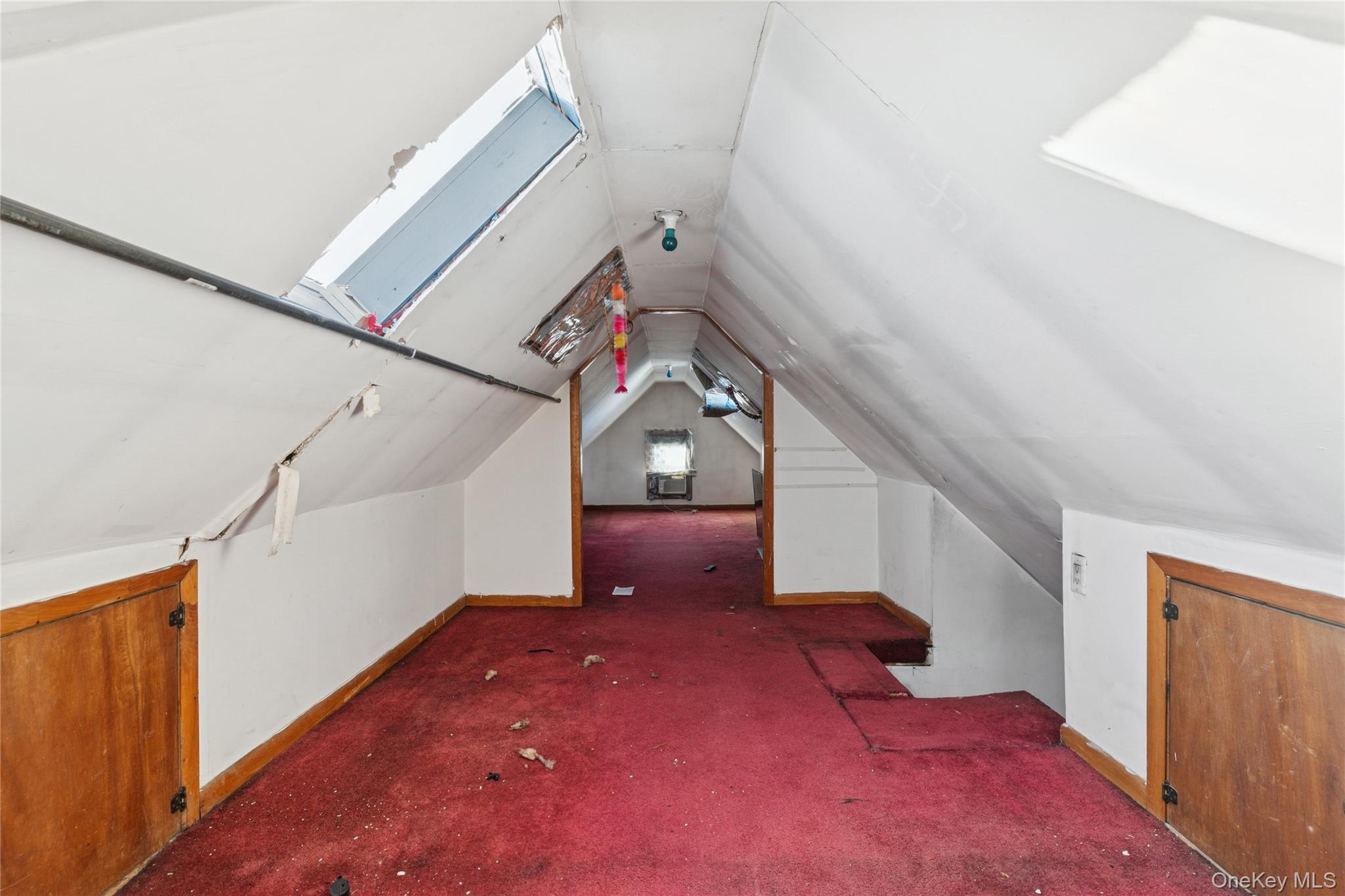 62-82 Booth Street Queens, NY 11374 - Photo 8 of 9 a view of a livingroom with a staircase